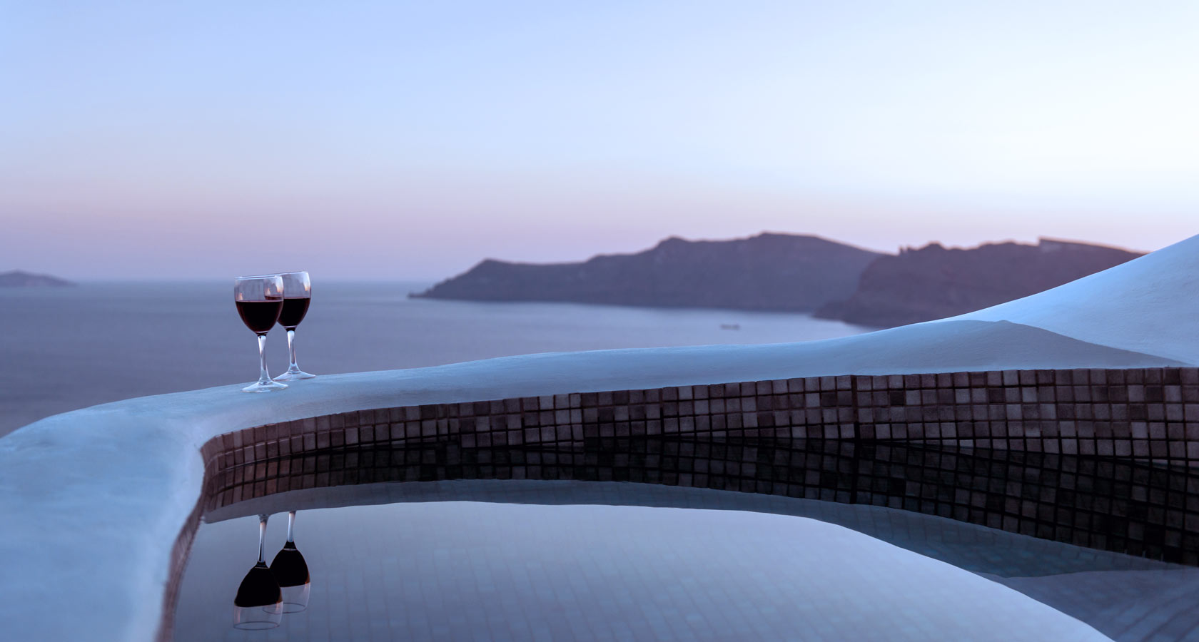 Romance & authentic hospitality in Anemomilos private villas in Santorini