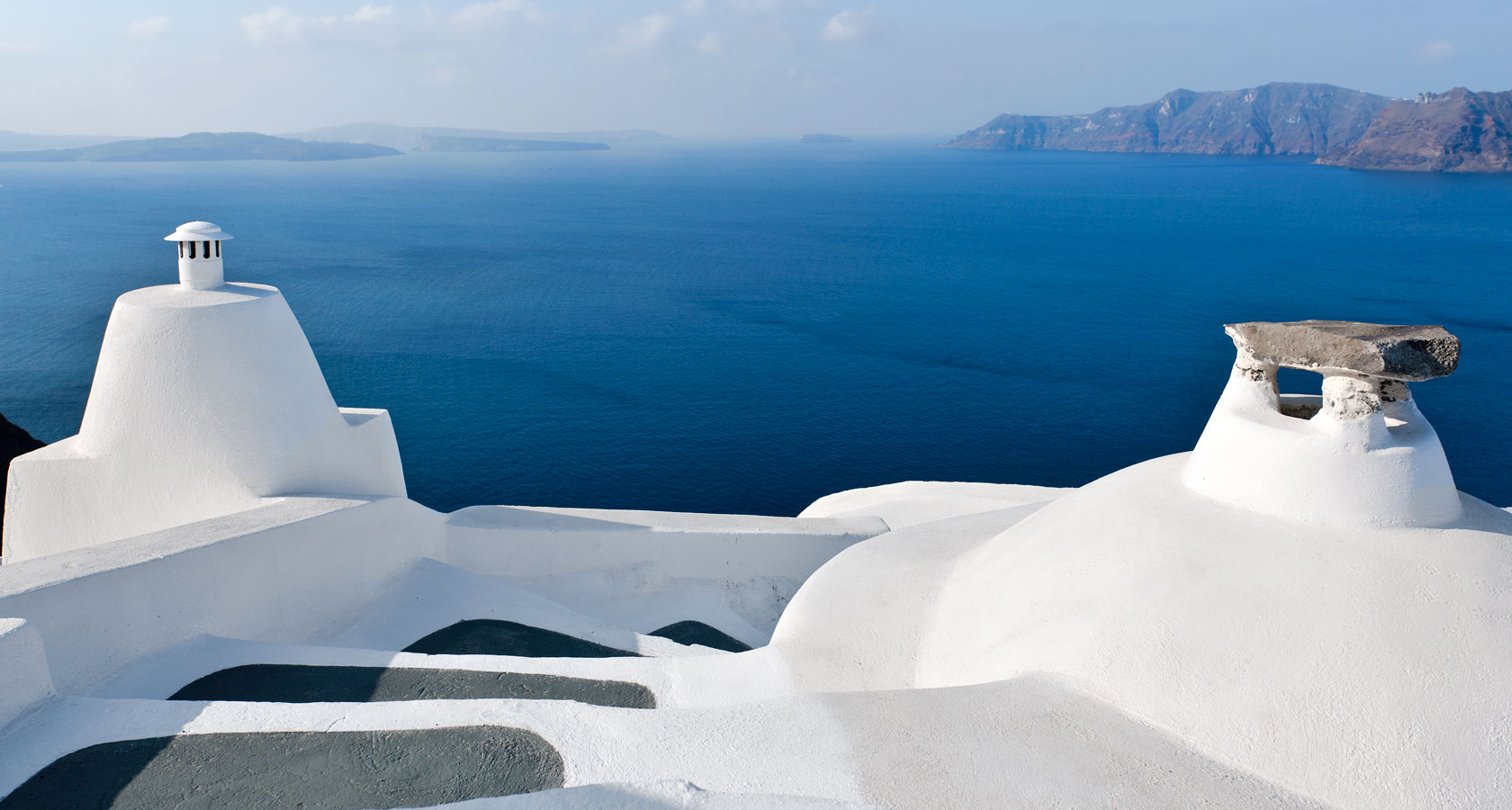 Romance & authentic hospitality in Anemomilos private villas in Santorini